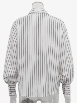 Blouse blanche pour femme col rabattu manches longues style décontracté avec nœuds.