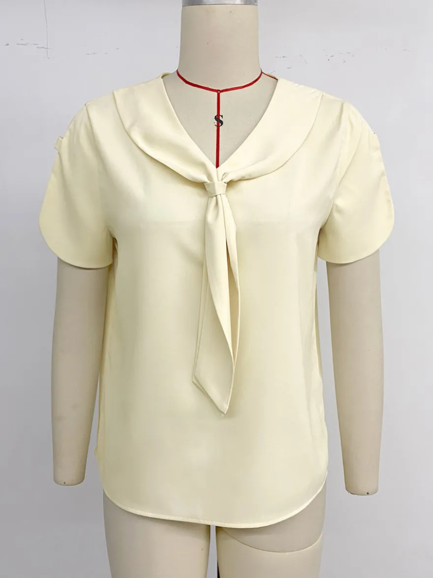 Blouse pour femme abricot col en V manches courtes style décontracté idéale pour l'été