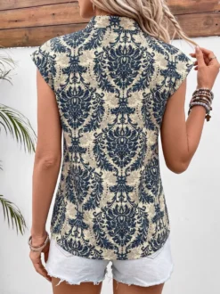 Blouse pour femme bleu foncé imprimée à col montant chic sans manches