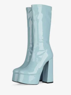 Bottes Gogo jaunes à plateforme et talon compensé en cuir verni brillant.