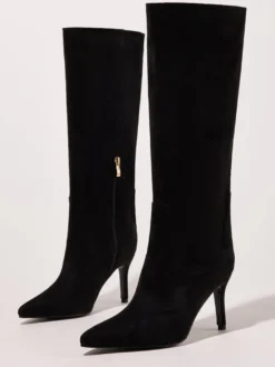 Bottes noires montantes à bout pointu et talons hauts