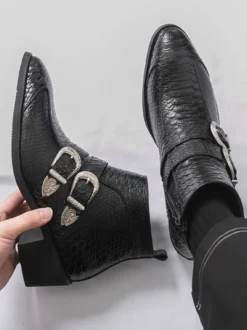 Bottines noires à bout pointu motif serpent et boucle