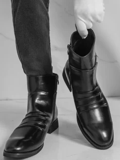 Bottines noires plates à bout rond et fermeture éclair pour homme