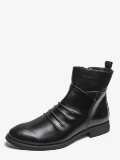 Bottines noires plates à bout rond et fermeture éclair pour homme