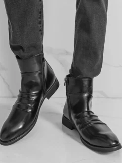 Bottines noires plates à bout rond et fermeture éclair pour homme