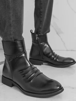 Bottines noires plates à bout rond et fermeture éclair pour homme
