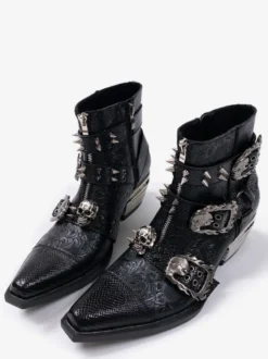 Bottines pour homme noires à bout pointu et talon épais ornées d'une boucle métallique
