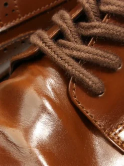 Chaussures de ville pour hommes style brogue bout rond lacets en cuir véritable.