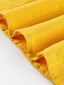 Chemise oversize à manches bouffantes texturées et col montant boutonné
