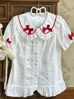Chemisiers Lolita doux haut Lolita rose à manches courtes volants nœuds chemise Lolita à blocs de couleurs