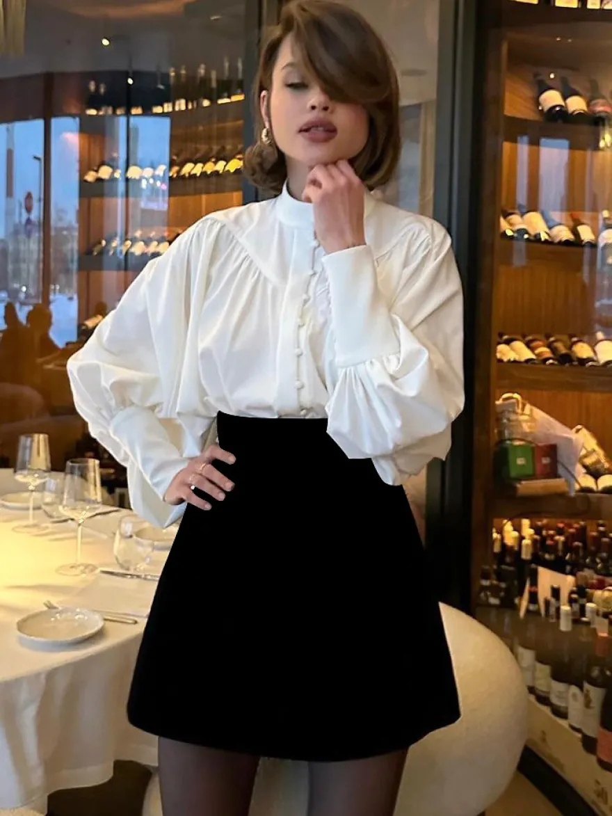 Chemisier vintage à manches bouffantes et col montant pour femme collection automne 2026