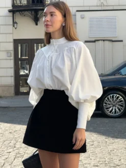 Chemisier vintage à manches bouffantes et col montant pour femme collection automne 2026