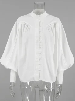Chemisier vintage à manches bouffantes et col montant pour femme collection automne 2026