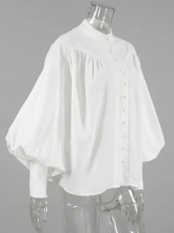 Chemisier vintage à manches bouffantes et col montant pour femme collection automne 2026