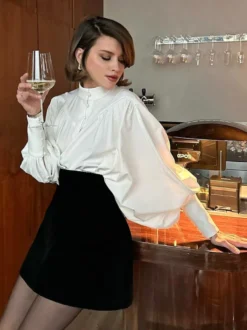 Chemisier vintage à manches bouffantes et col montant pour femme collection automne 2026