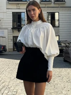Chemisier vintage à manches bouffantes et col montant pour femme collection automne 2026