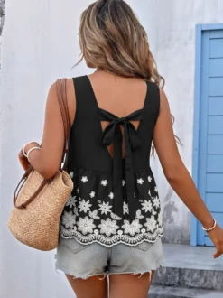 Débardeur péplum blanc à col rond et broderie florale sans manches pour femme