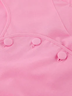 Ensemble deux pièces rose avec haut court et jupe longue taille haute pour l'été 2026