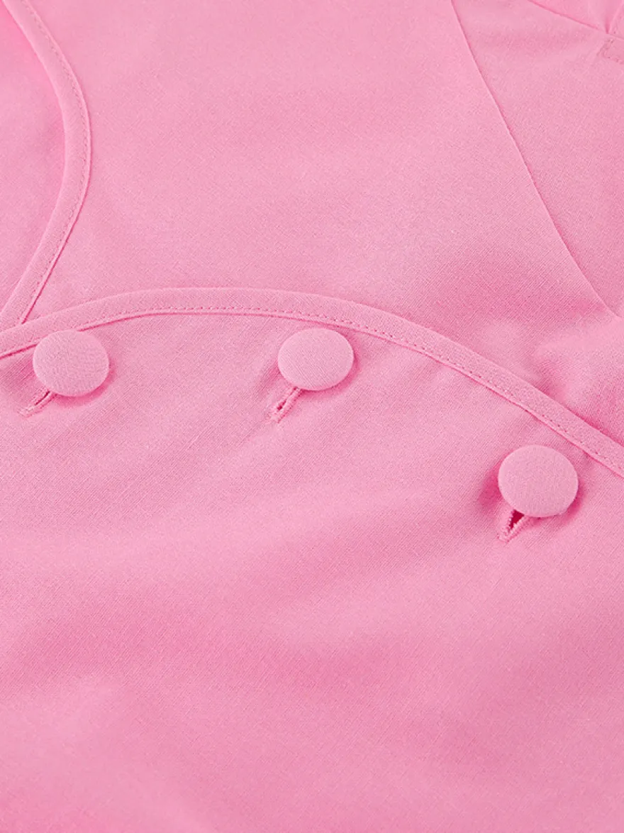 Ensemble deux pièces rose avec haut court et jupe longue taille haute pour l'été 2026