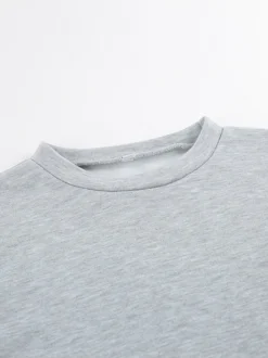 Ensemble lounge gris chiné : haut oversize à manches courtes et taille élastique pantalon large.