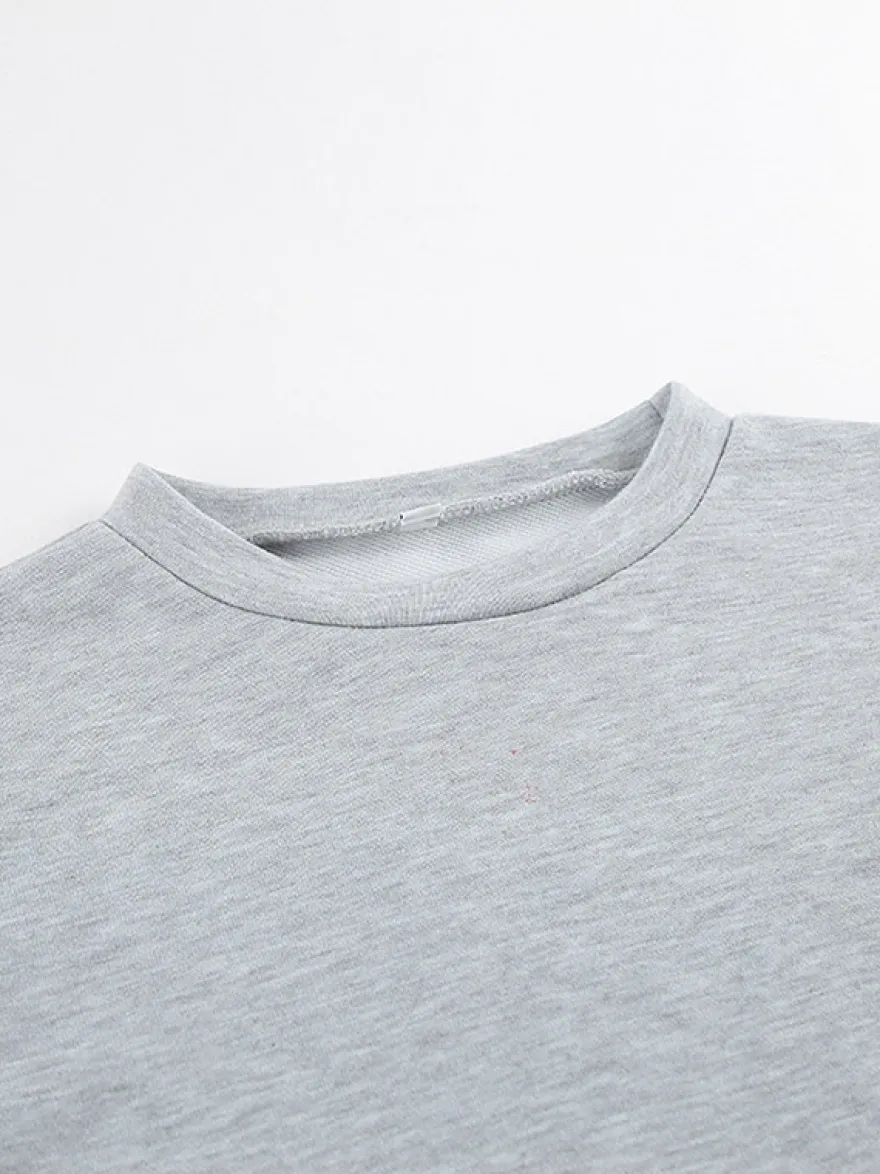 Ensemble lounge gris chiné : haut oversize à manches courtes et taille élastique pantalon large.