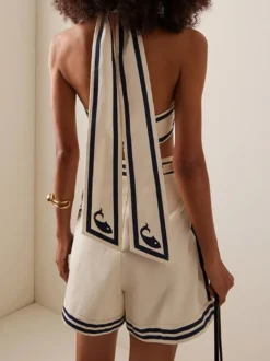 Ensemble maillot de bain deux tons blanc élégant à lacets et dos nu.