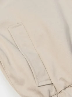 Ensemble 2 pièces : pantalon blanc plissé en polyester col rabattu manches longues.