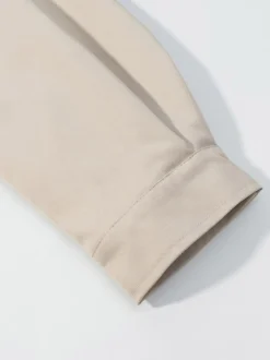 Ensemble 2 pièces : pantalon blanc plissé en polyester col rabattu manches longues.