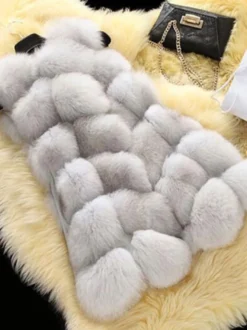 Gilet en fausse fourrure veste mi-longue d'hiver écologique sans manches pour femme 2026