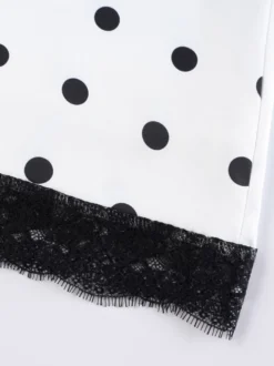 Jupe crayon élégante pour soirée formelle taille haute et coupe ajustée en satin à pois.