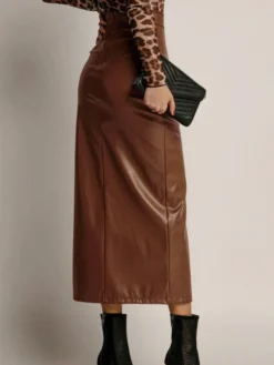 Jupe en similicuir avec fente latérale taille haute couleur unie jupe mi-longue chic en PU pour femme 2026