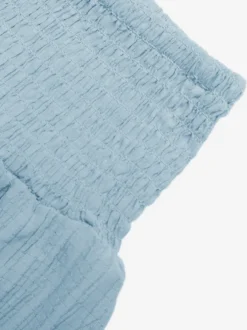 Jupe longue maxi à volants et smocks taille haute pour femme texturée et fluide idéale pour la plage.
