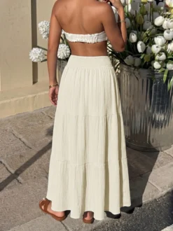 Jupe longue maxi à volants et smocks taille haute pour femme texturée et fluide idéale pour la plage.