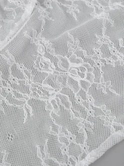 Jupes blanches en dentelle élégantes coupe asymétrique longueur genou bas pour femmes