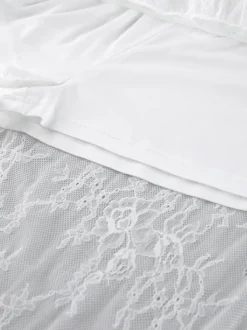Jupes blanches en dentelle élégantes coupe asymétrique longueur genou bas pour femmes