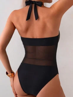 Maillot de bain une pièce dos nu décolleté en V profond découpes en maille bretelles et nouer dans le dos coupe amincissante