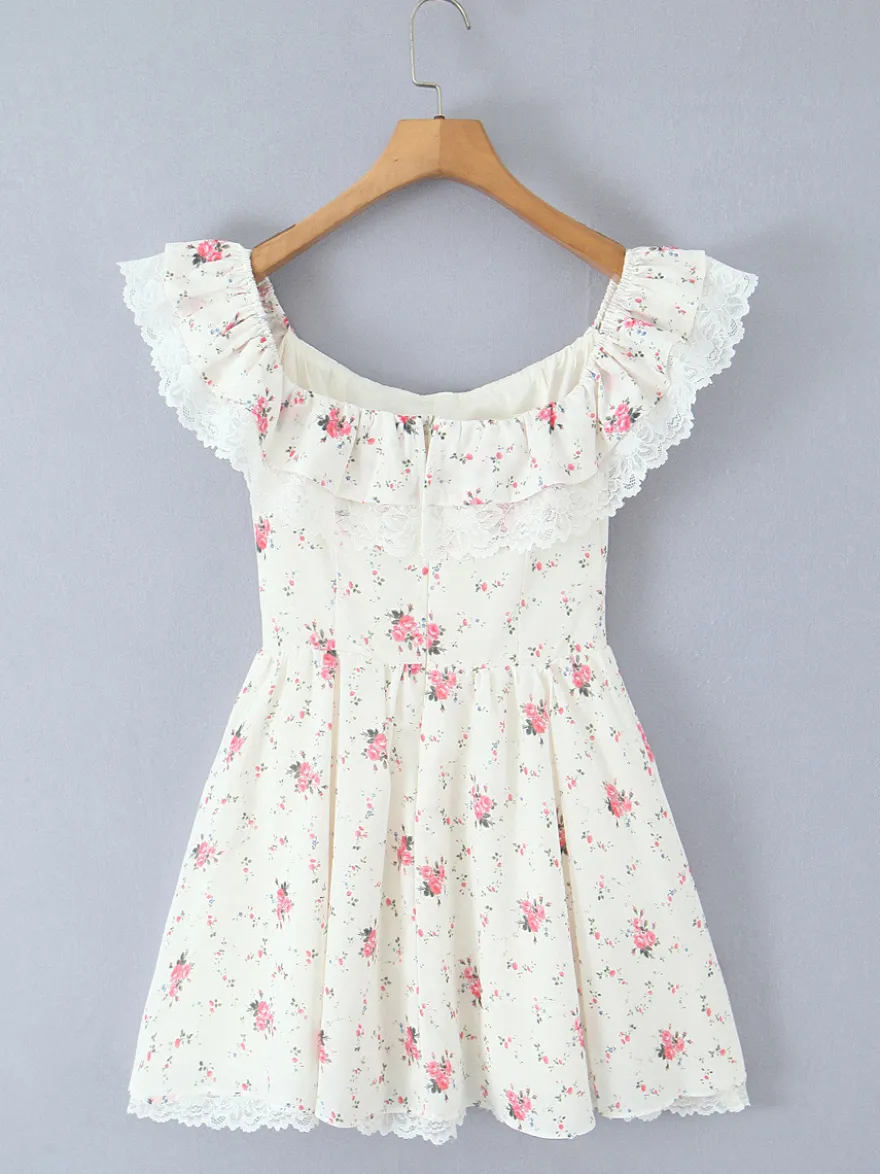 Mini-robe fleurie à épaules dénudées et nœud pour l'été 2026