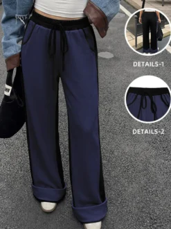 Pantalon de survêtement large à rayures latérales pour femme taille élastique avec cordon de serrage et poches.