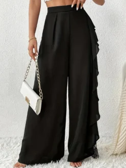 Pantalon noir uni à volants et taille naturelle idéal pour l'été
