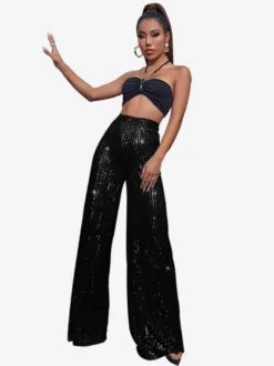 Pantalon palazzo à sequins taille haute et jambes larges style clubwear.