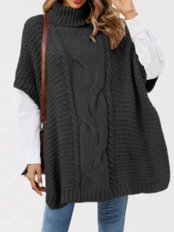 Pull ample décontracté à col montant en maille style cape sans manches en fil épais torsadé.