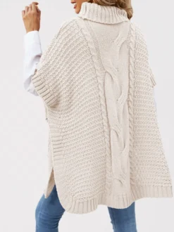 Pull ample décontracté à col montant en maille style cape sans manches en fil épais torsadé.