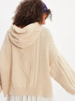Pull à capuche en maille torsadée pour femme coupe ample manches longues style oversize style décontracté. Haut à capuche en grosse maille.