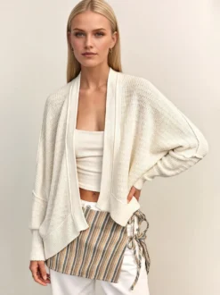 Pull oversize en maille ajourée col V manches chauve-souris ourlet asymétrique cardigan ouvert sur le devant