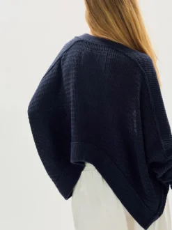 Pull oversize en maille ajourée col V manches chauve-souris ourlet asymétrique cardigan ouvert sur le devant
