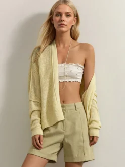 Pull oversize en maille ajourée col V manches chauve-souris ourlet asymétrique cardigan ouvert sur le devant