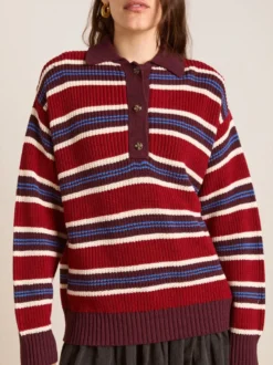 Pull à rayures rétro à col polo pour femme demi-boutonné coupe ample et oversize en maille.