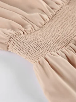 Robe courte kaki sans manches dos nu col montant taille naturelle