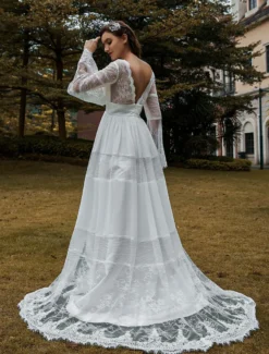 Robe de mariée bohème col V manche longue dos nu à traîne