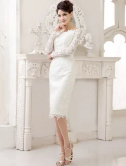 Robe de mariée courte col bateau manche longue zip sur dos en dentelle